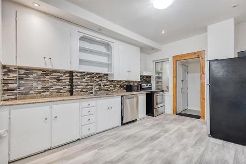 558 Mountain Avenue, Winnipeg, MB - Indoor Photo Showing Kitchen With Double Sink