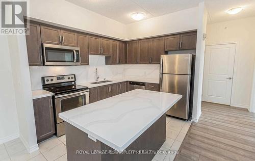 313 - 640 Sauve Street, Milton, ON - Indoor Photo Showing Kitchen With Double Sink