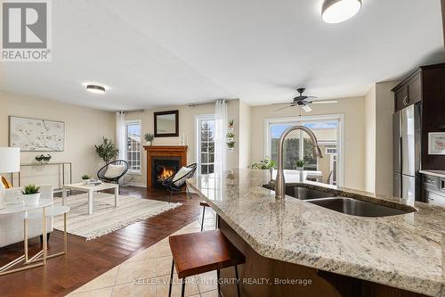 311 Gallantry Way, Ottawa, ON - Indoor Photo Showing Kitchen With Fireplace With Double Sink