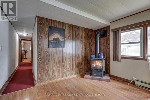 Gas Fireplace in Dining Area Heats Living Space. - 20 Second Street, Norfolk (Delhi), ON - Indoor Photo Showing Other Room