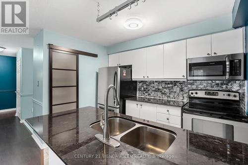 #309 - 98 Aspen Spring Drive, Clarington, ON - Indoor Photo Showing Kitchen With Double Sink