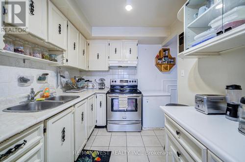 18 - 7475 Goreway Drive, Mississauga, ON - Indoor Photo Showing Kitchen With Double Sink