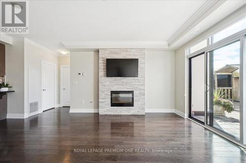 301 - 150 Wellington Street E, Guelph, ON - Indoor Photo Showing Living Room With Fireplace