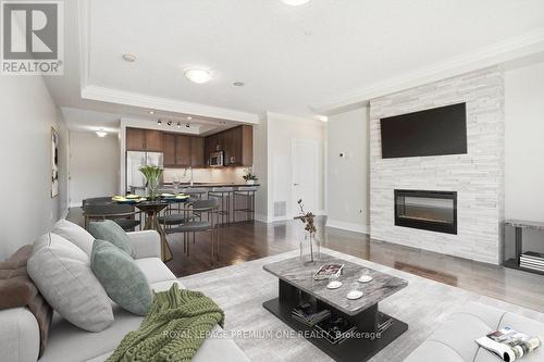 301 - 150 Wellington Street E, Guelph, ON - Indoor Photo Showing Living Room With Fireplace