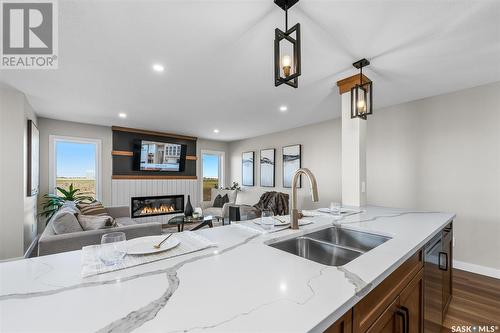 1060 West Park Boulevard, Moose Jaw, SK - Indoor Photo Showing Kitchen With Fireplace With Double Sink