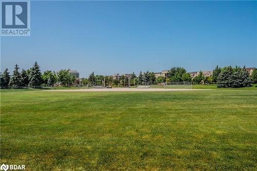 View of property's community featuring a yard - 2300 Parkhaven Boulevard Unit# 103, Oakville, ON - Outdoor With View