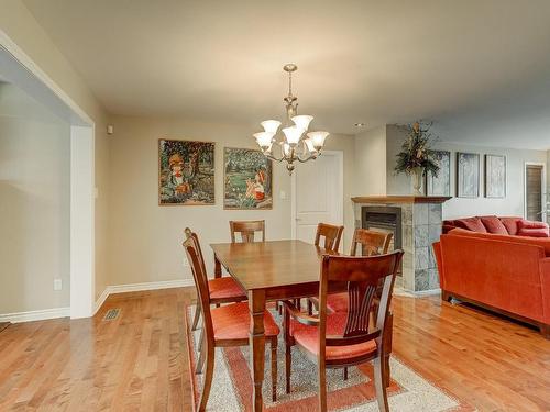 Dining room - 1159 Rue Bellerive, Saint-Jean-Sur-Richelieu, QC - Indoor Photo Showing Dining Room With Fireplace