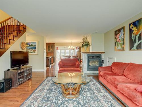 Living room - 1159 Rue Bellerive, Saint-Jean-Sur-Richelieu, QC - Indoor Photo Showing Living Room With Fireplace