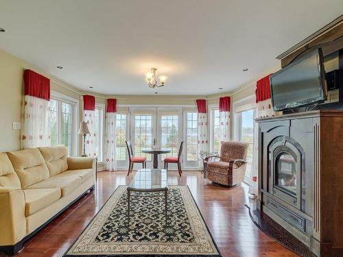 Den - 1159 Rue Bellerive, Saint-Jean-Sur-Richelieu, QC - Indoor Photo Showing Living Room With Fireplace