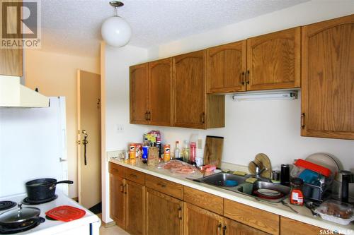 144 First Avenue N, Yorkton, SK - Indoor Photo Showing Kitchen With Double Sink