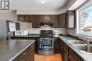 410 Nesbitt Way, Saskatoon, SK  - Indoor Photo Showing Kitchen With Double Sink 