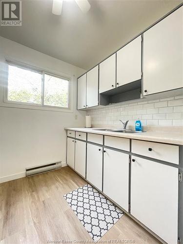 2673 Vine Court Unit# 2673, Windsor, ON - Indoor Photo Showing Kitchen With Double Sink