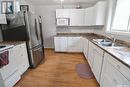 328 6Th Avenue Se, Swift Current, SK  - Indoor Photo Showing Kitchen With Double Sink 