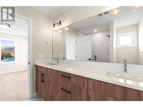 Spacious Primary Ensuite with Dual Sinks and Extra Long Mirror - 3907 26 Street Unit# 3, Vernon, BC - Indoor Photo Showing Bathroom