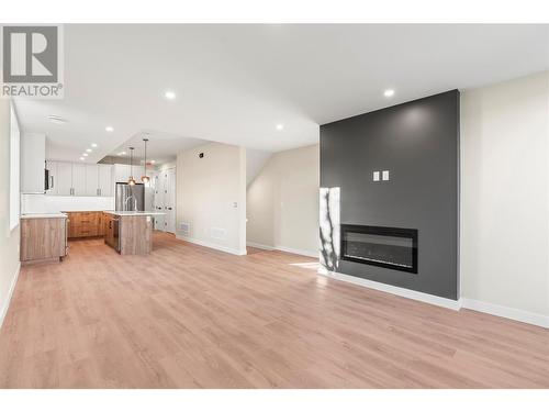 Main Floor - 3907 26 Street Unit# 3, Vernon, BC - Indoor Photo Showing Living Room With Fireplace