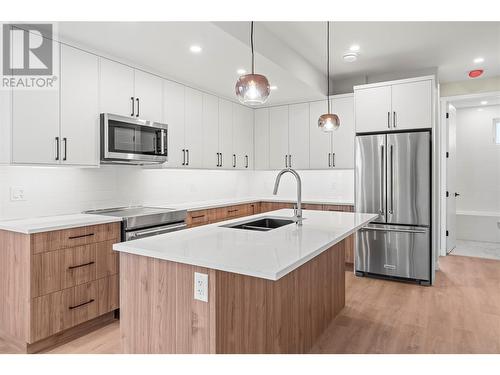 Stylish Lighting - 3907 26 Street Unit# 3, Vernon, BC - Indoor Photo Showing Kitchen With Stainless Steel Kitchen With Double Sink With Upgraded Kitchen