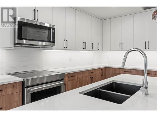 Under Counter Lighting - 3907 26 Street Unit# 3, Vernon, BC - Indoor Photo Showing Kitchen With Stainless Steel Kitchen With Double Sink With Upgraded Kitchen