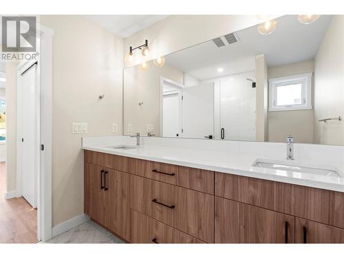 Ensuite has Large Extended Mirror - 3907 26 Street Unit# 1, Vernon, BC - Indoor Photo Showing Bathroom