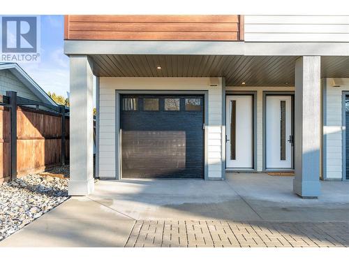 Front Door and Tandem Garage - 3907 26 Street Unit# 1, Vernon, BC - Outdoor With Deck Patio Veranda With Exterior