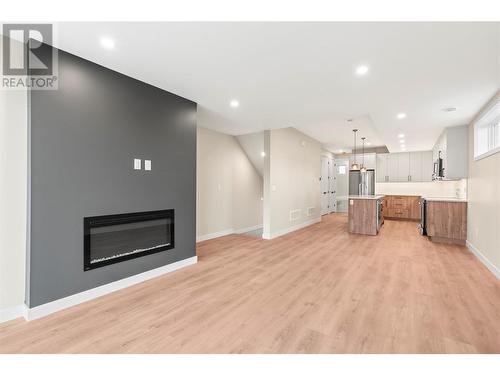 Open Living Area - 3907 26 Street Unit# 1, Vernon, BC - Indoor Photo Showing Other Room With Fireplace