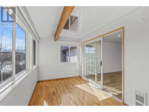 Beautiful wood beam and an abundance of light for plant people - 3000 Richter Street Unit# 21, Kelowna, BC - Indoor Photo Showing Other Room