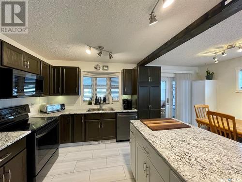 1230 Arnason Street N, Regina, SK - Indoor Photo Showing Kitchen With Double Sink