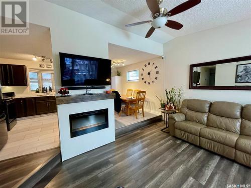 1230 Arnason Street N, Regina, SK - Indoor Photo Showing Living Room With Fireplace