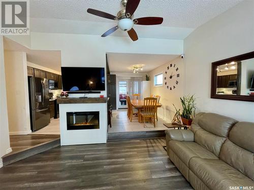 1230 Arnason Street N, Regina, SK - Indoor Photo Showing Living Room With Fireplace