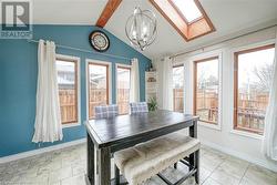 Breakfast nook with vaulted ceiling and skylights - 