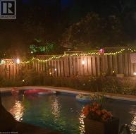 View of pool at night during the summer - 