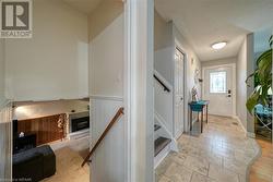 View of the front hallway and stairs to second and lower level - 