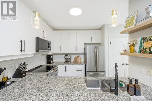 310 - 383 Main Street E, Milton, ON - Indoor Photo Showing Kitchen With Stainless Steel Kitchen With Upgraded Kitchen