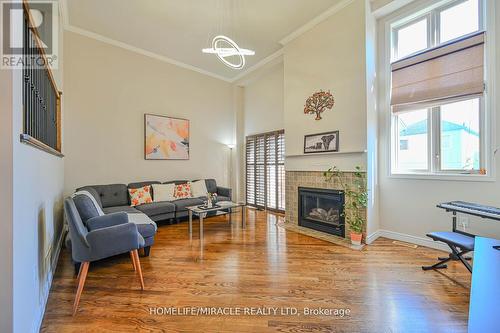 66 - 7385 Magistrate Terrace, Mississauga, ON - Indoor Photo Showing Living Room With Fireplace