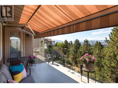 Balcony with Awning and Roller Screen - 580 Denali Drive, Kelowna, BC - Outdoor With Exterior