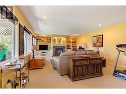 Family Room with large wall to wall windows and new blinds. - 