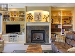 Gas fireplace and built-in cabinetry in family room - 