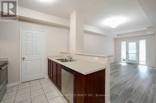 101 - 5705 Long Valley Road, Mississauga, ON - Indoor Photo Showing Kitchen With Double Sink