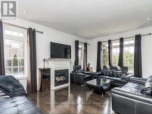 23 Alice Springs Crescent, Brampton, ON - Indoor Photo Showing Living Room With Fireplace