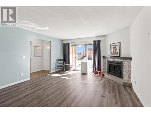 2433 Ingram Road Unit# 16, West Kelowna, BC - Indoor Photo Showing Living Room With Fireplace