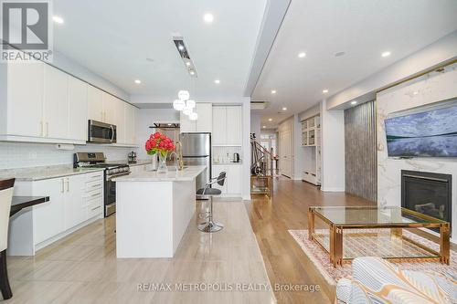 203 Beechborough Crescent, East Gwillimbury, ON - Indoor Photo Showing Kitchen With Fireplace With Upgraded Kitchen