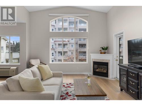 Top floor of the building - 1950 Durnin Road Unit# 408, Kelowna, BC - Indoor Photo Showing Living Room With Fireplace