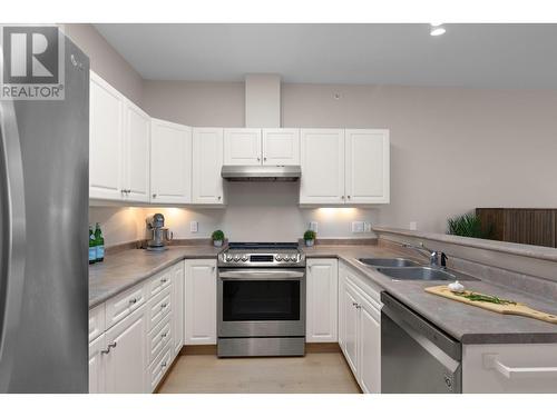 Stainless steel appliances - 1950 Durnin Road Unit# 408, Kelowna, BC - Indoor Photo Showing Kitchen With Stainless Steel Kitchen With Double Sink