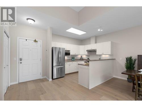 White Oak hardwood floors - 1950 Durnin Road Unit# 408, Kelowna, BC - Indoor Photo Showing Kitchen