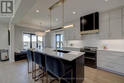 133 Basil Crescent, Middlesex Centre, ON - Indoor Photo Showing Kitchen With Upgraded Kitchen