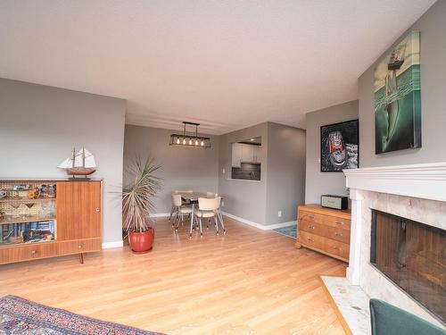 305-1252 Pandora Ave, Victoria, BC - Indoor Photo Showing Living Room With Fireplace