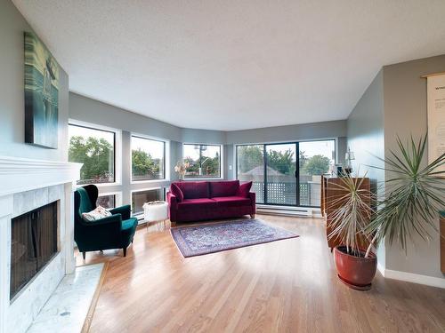 305-1252 Pandora Ave, Victoria, BC - Indoor Photo Showing Living Room With Fireplace