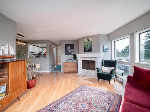 305-1252 Pandora Ave, Victoria, BC - Indoor Photo Showing Living Room With Fireplace