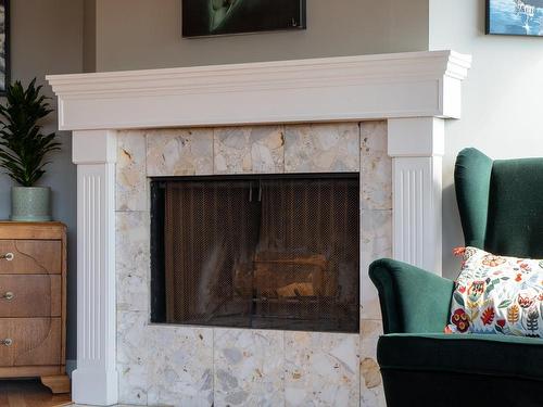 305-1252 Pandora Ave, Victoria, BC - Indoor Photo Showing Living Room With Fireplace