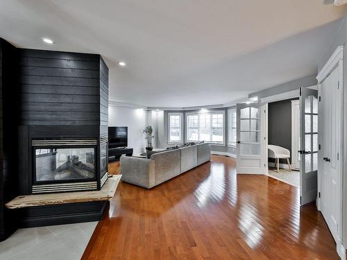 Salon - 1060  - 1062 Av. De Châteaubriant, Mascouche, QC - Indoor Photo Showing Other Room With Fireplace