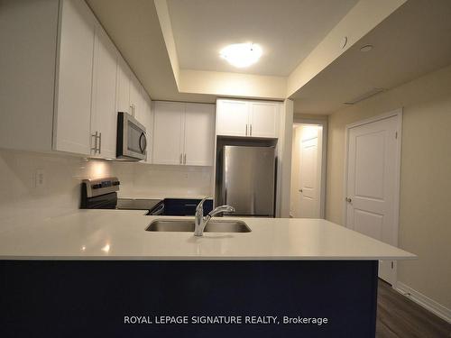 107-1573 Rose Way, Milton, ON - Indoor Photo Showing Kitchen With Double Sink